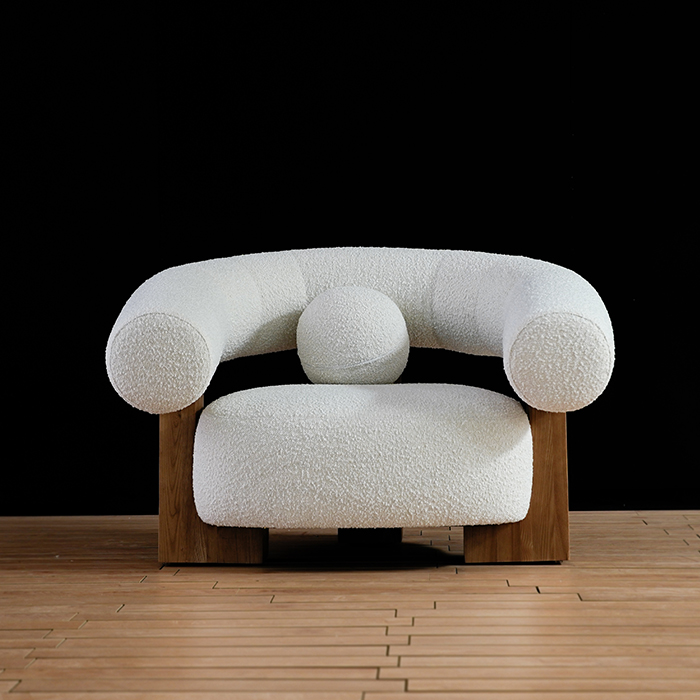 Poltrona moderna imbottita in pile Teddy con pouf 